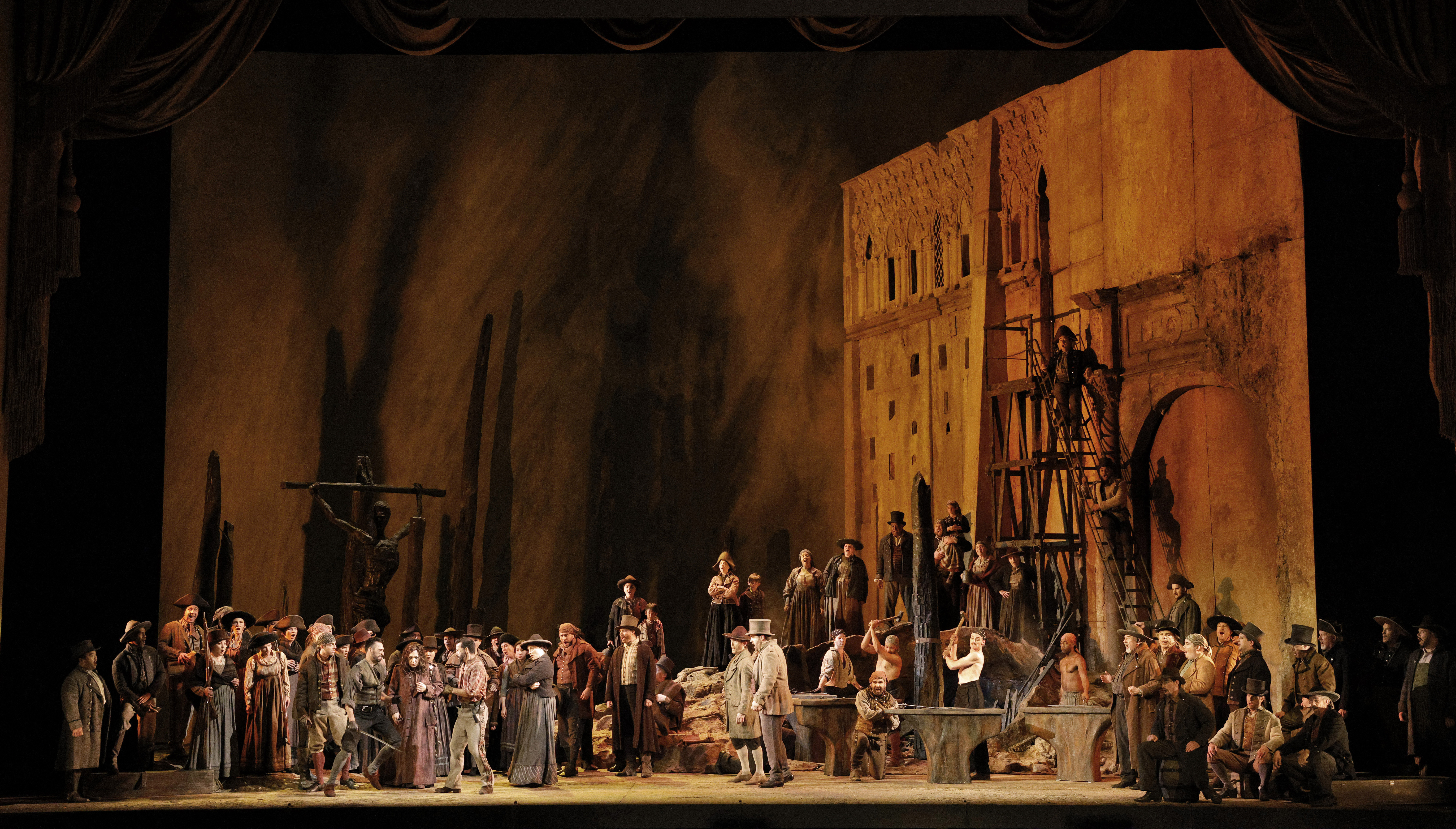 stage with people standing and singing