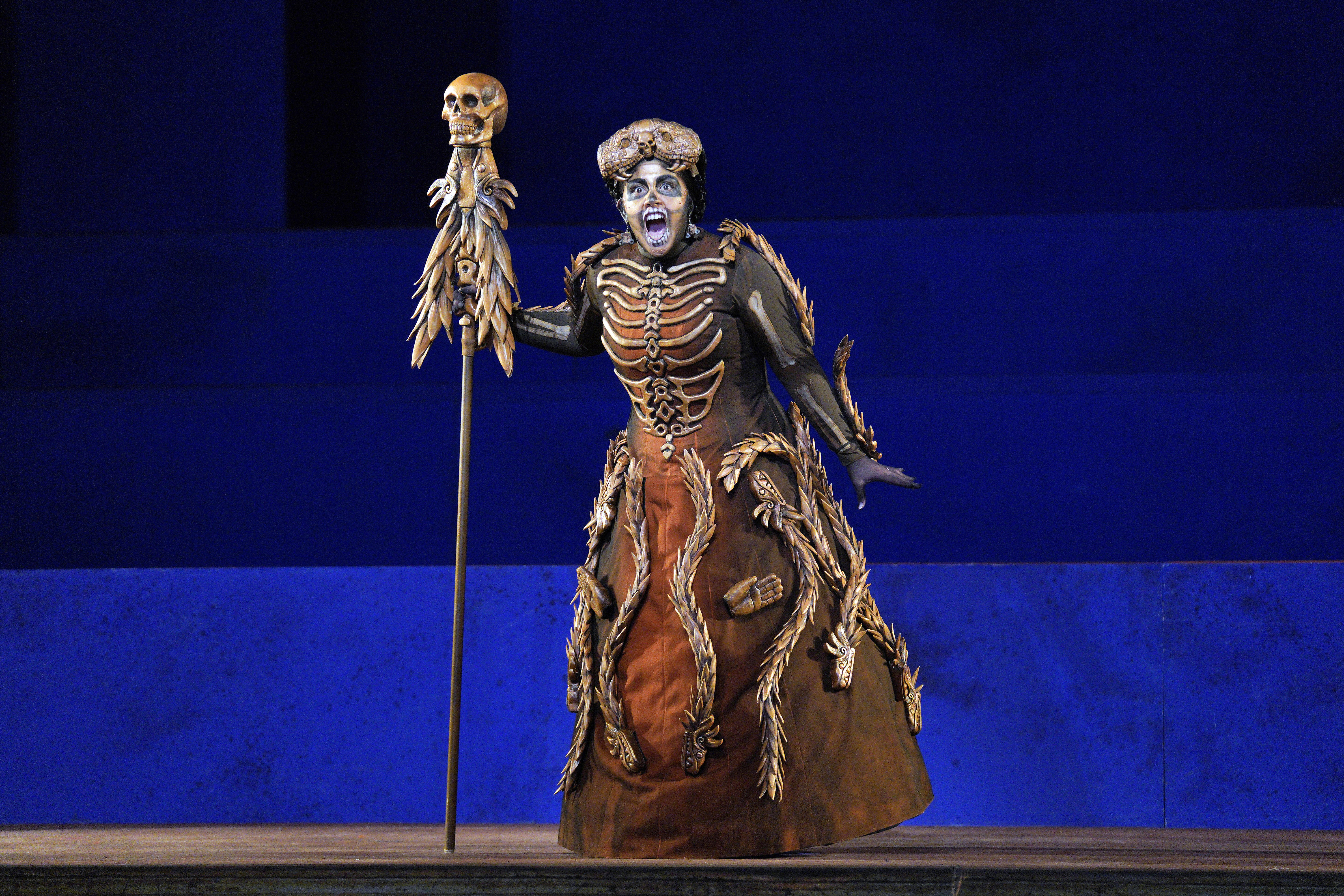 Scene from Frida of a woman dressed in a skeleton costume on stage.