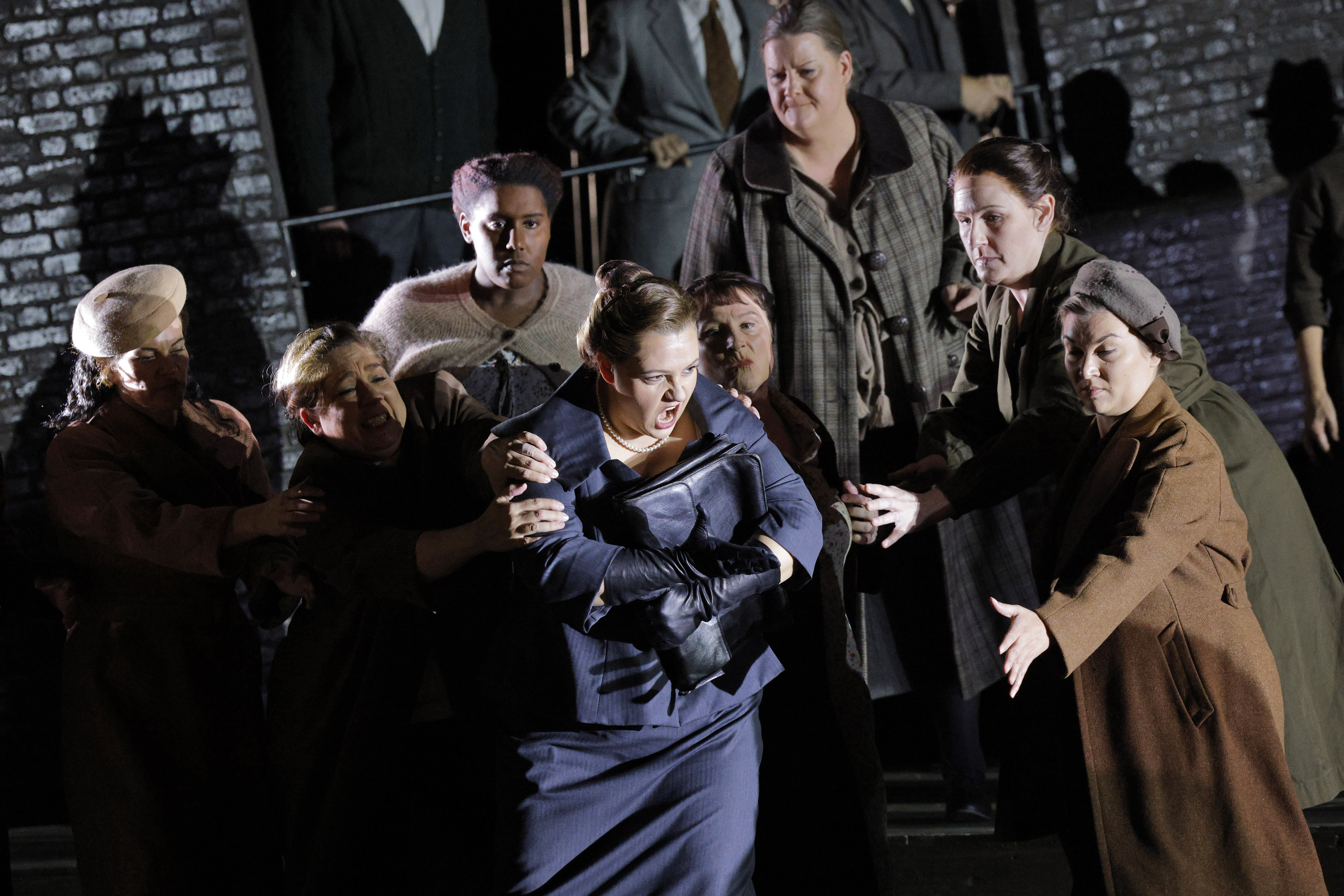 women being restrained by other people